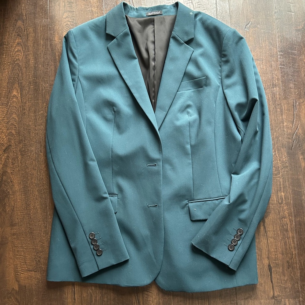 Women’s dark green suit. Jacket and pants.